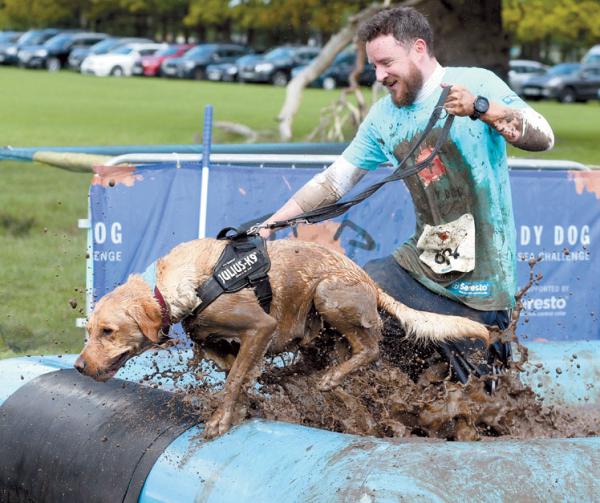 In pictures Thousands take part in Battersea Muddy Dog Challenge