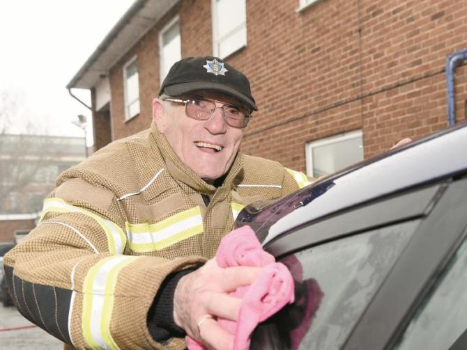 Firefighters brave the rain to raise £1939 at charity car wash Photo