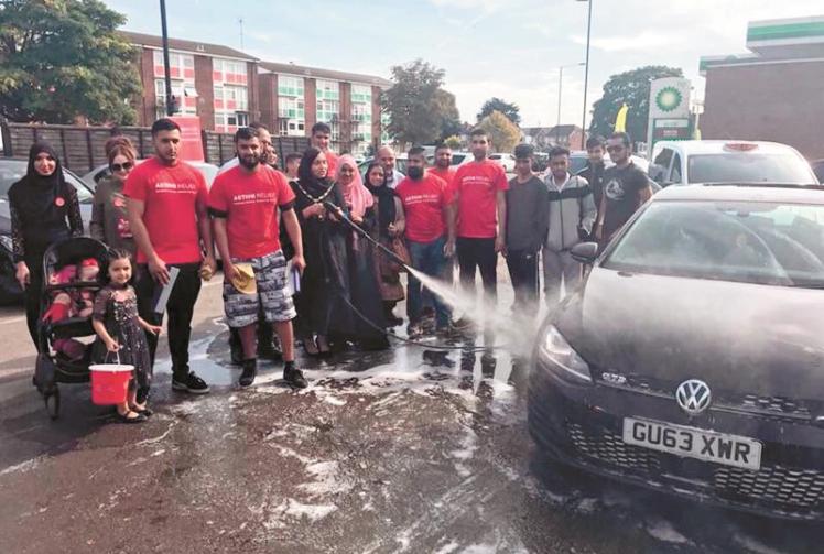 Thousands raised at charity car wash - Photo 1 of 1 - Slough Express