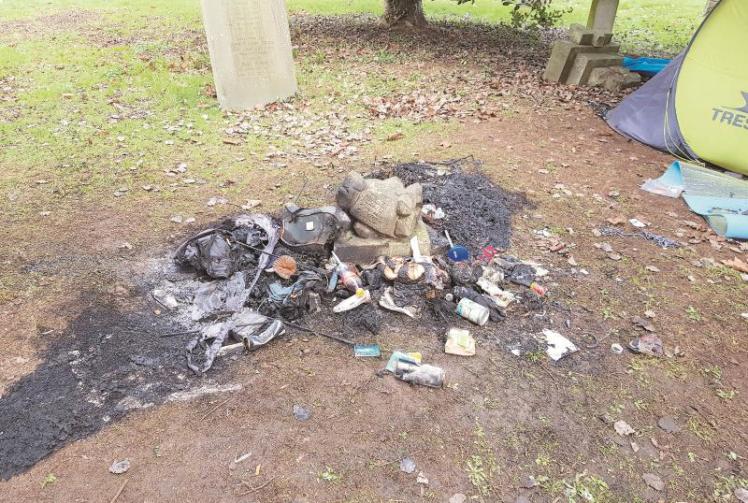Campers who defecated on graves and started fires to be evicted from churchyard