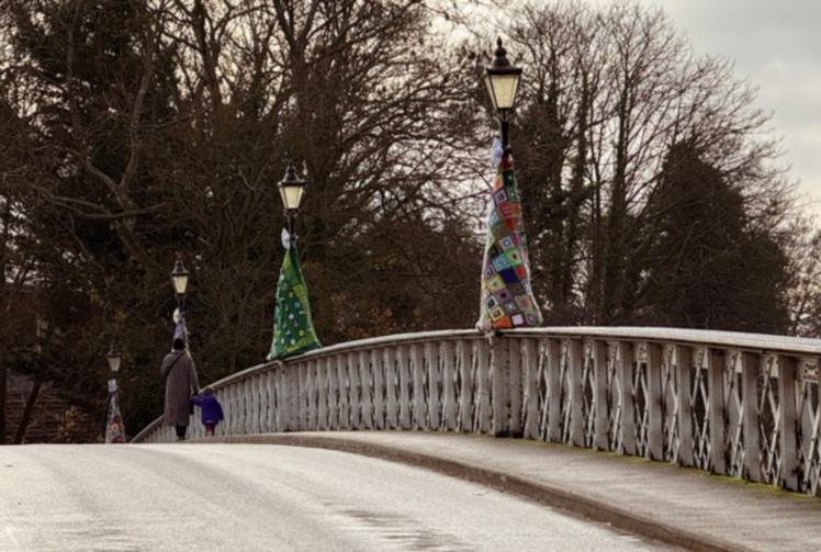 Knitting group adorn bridge with &lsquo;trees&rsquo; in aid of church