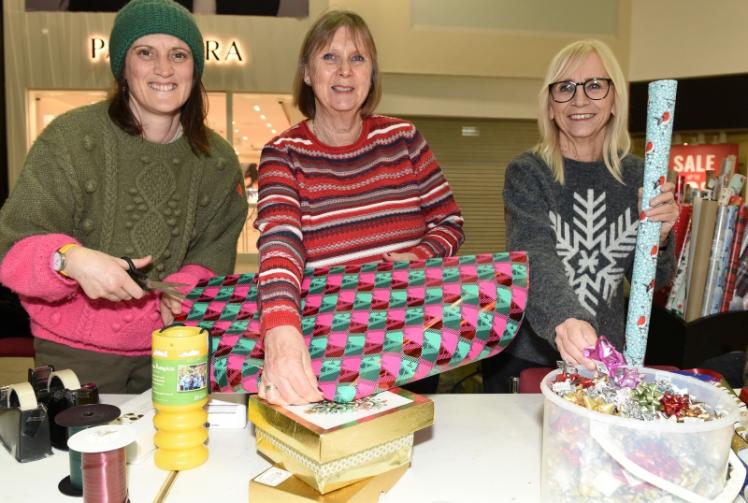 Volunteers wrap gifts in Maidenhead's Nicholsons Centre to raise funds for Thames Hospice